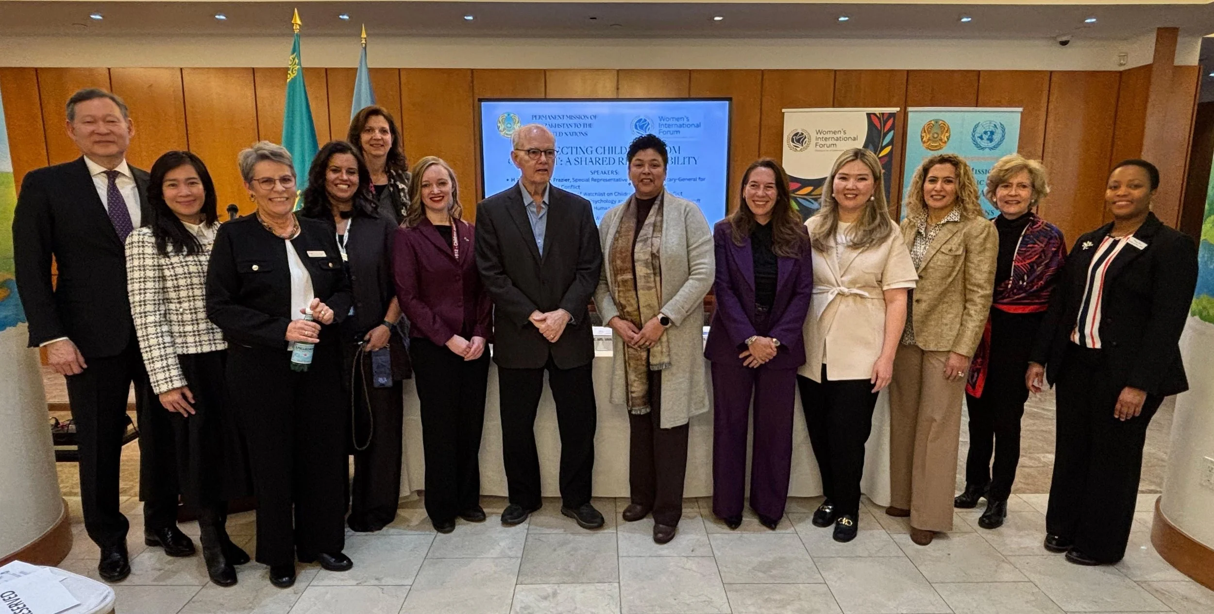 Panelists standing in front of the room