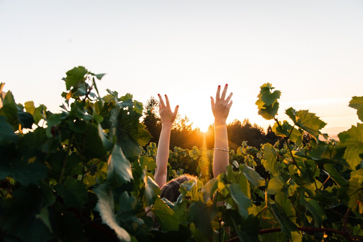 Woman in vineyards in Oregon in the Willamette Valley