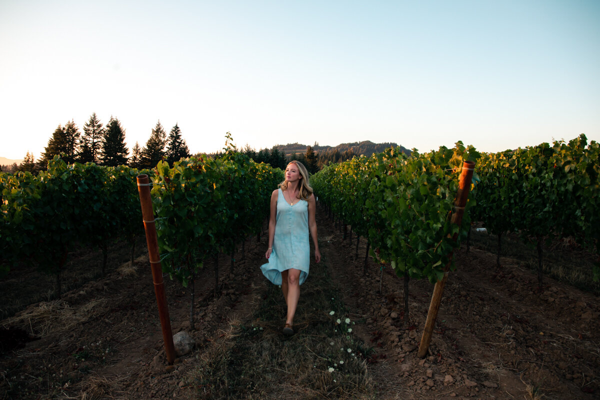 Woman in vineyards in Oregon in the Willamette Valley