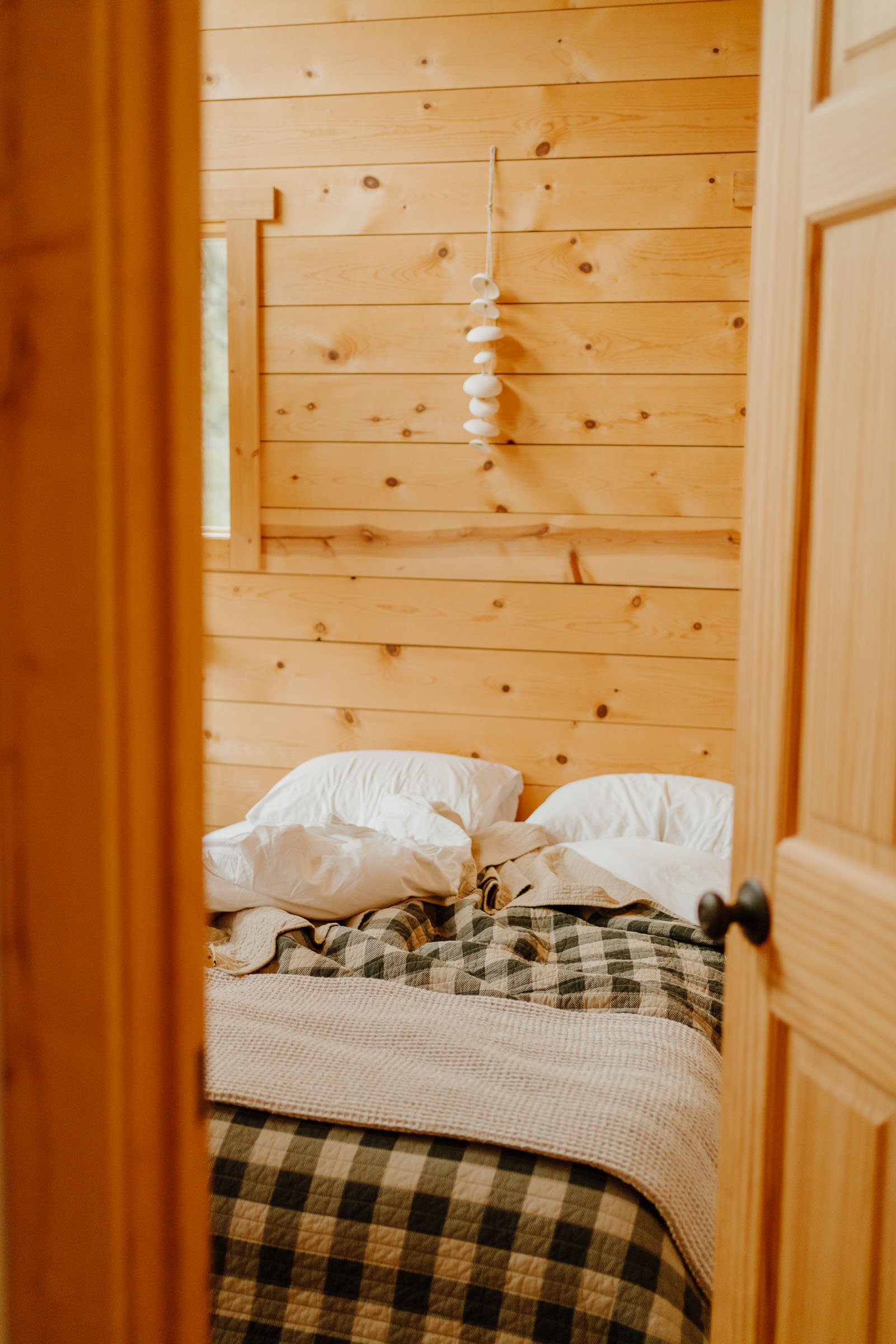 Cabin bedroom at the Gather Indie Treehouse Washington Airbnb