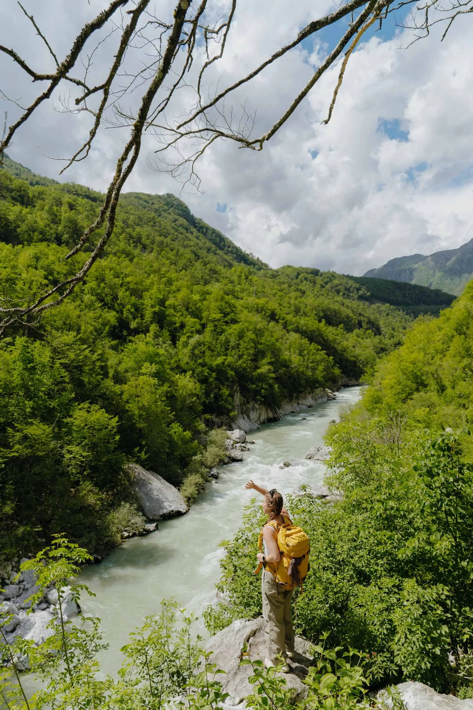 Woman looking out over the Soča River in the Soca Valley, Alpe Adria Trail, Slovenia