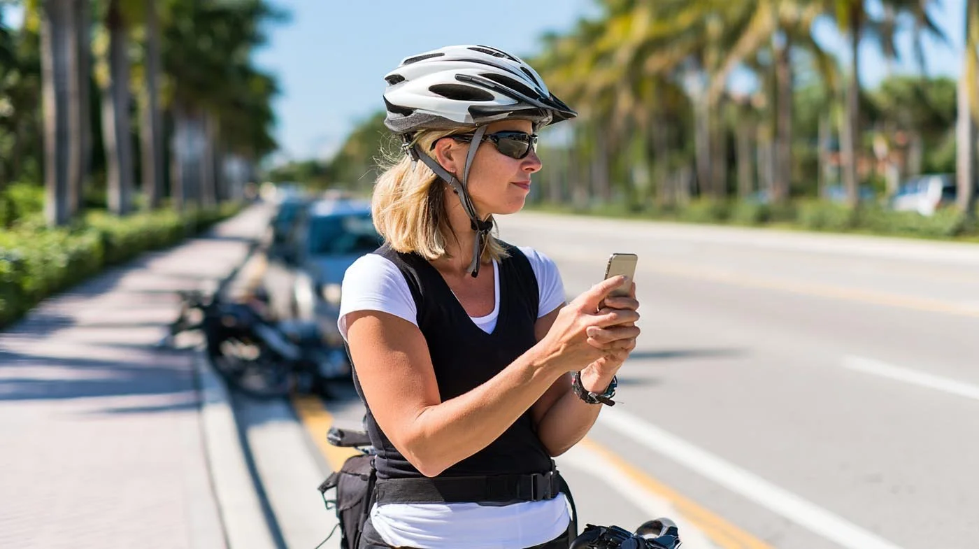 Cyclist photographing the scene after a bicycle accident