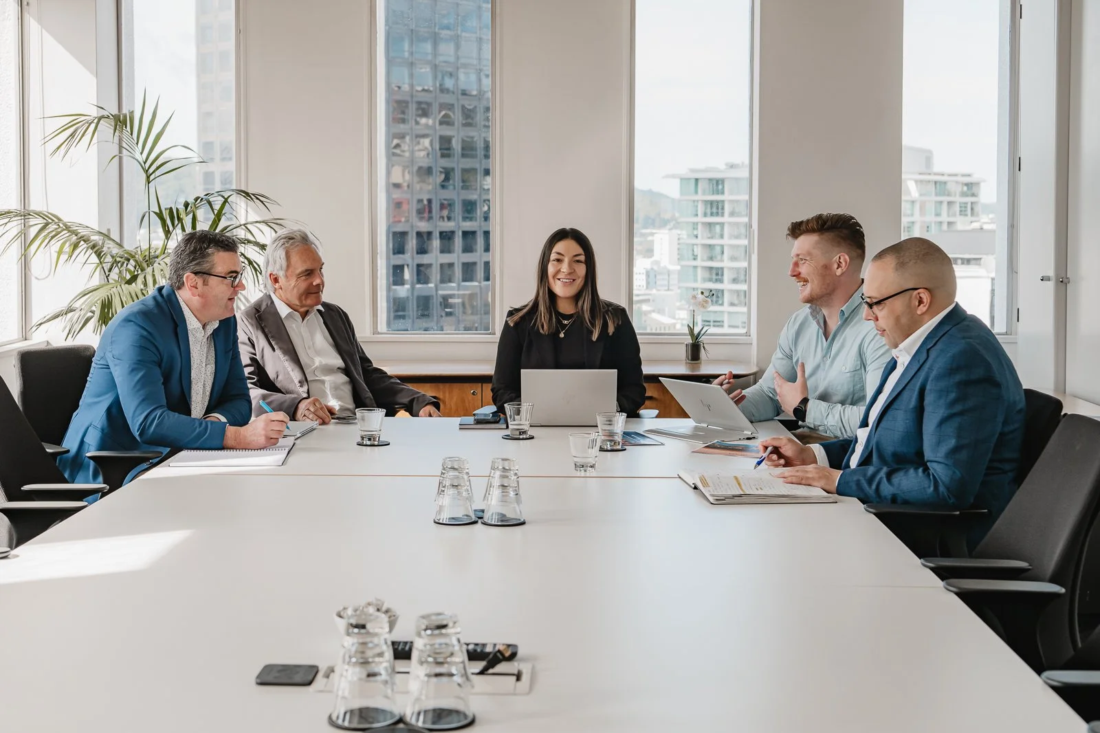 Corporate team meeting photography in Wellington office environment.