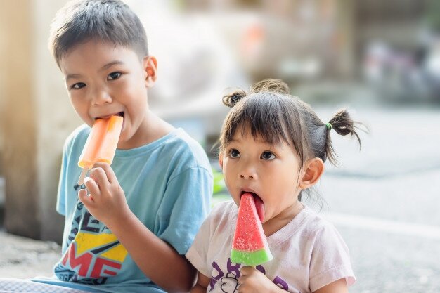 selective-focus-at-happy-asian-child-girl-and-her-brother-eating-an-pink-vanilla-ice-cream-summer-season_75876-124.jpg