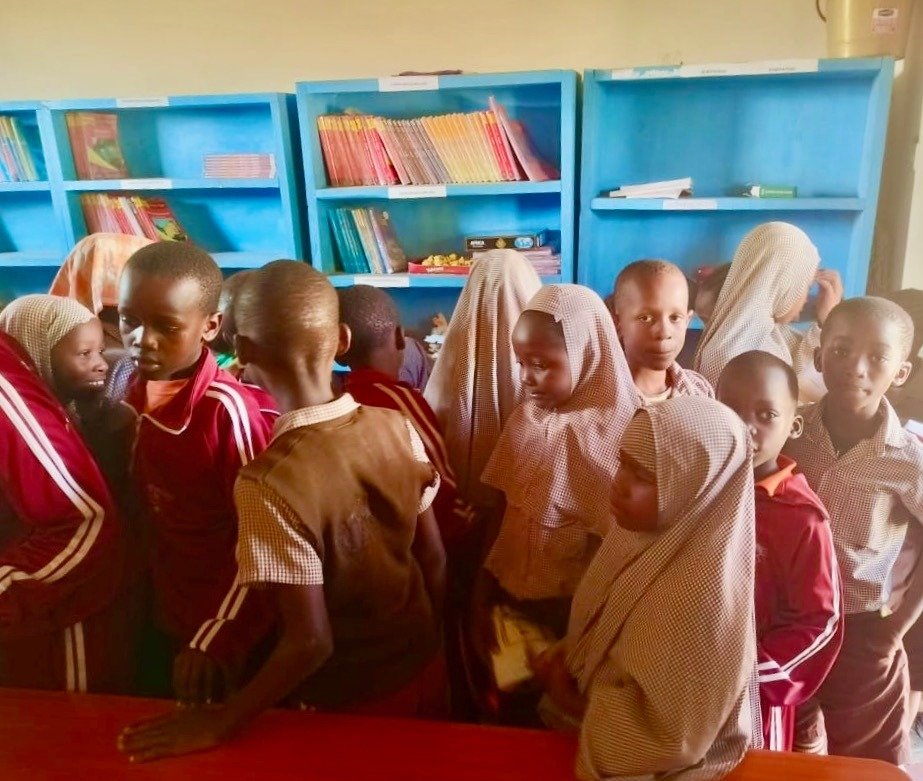 Kenyan librarian Mwanaisha, can only accommodate 1/4 of the people coming to the Kenya Keys Community Library each day.  She gives the rest a book to take home or allows them to read sitting outside.  It's a great problem to have!  The new and  much 