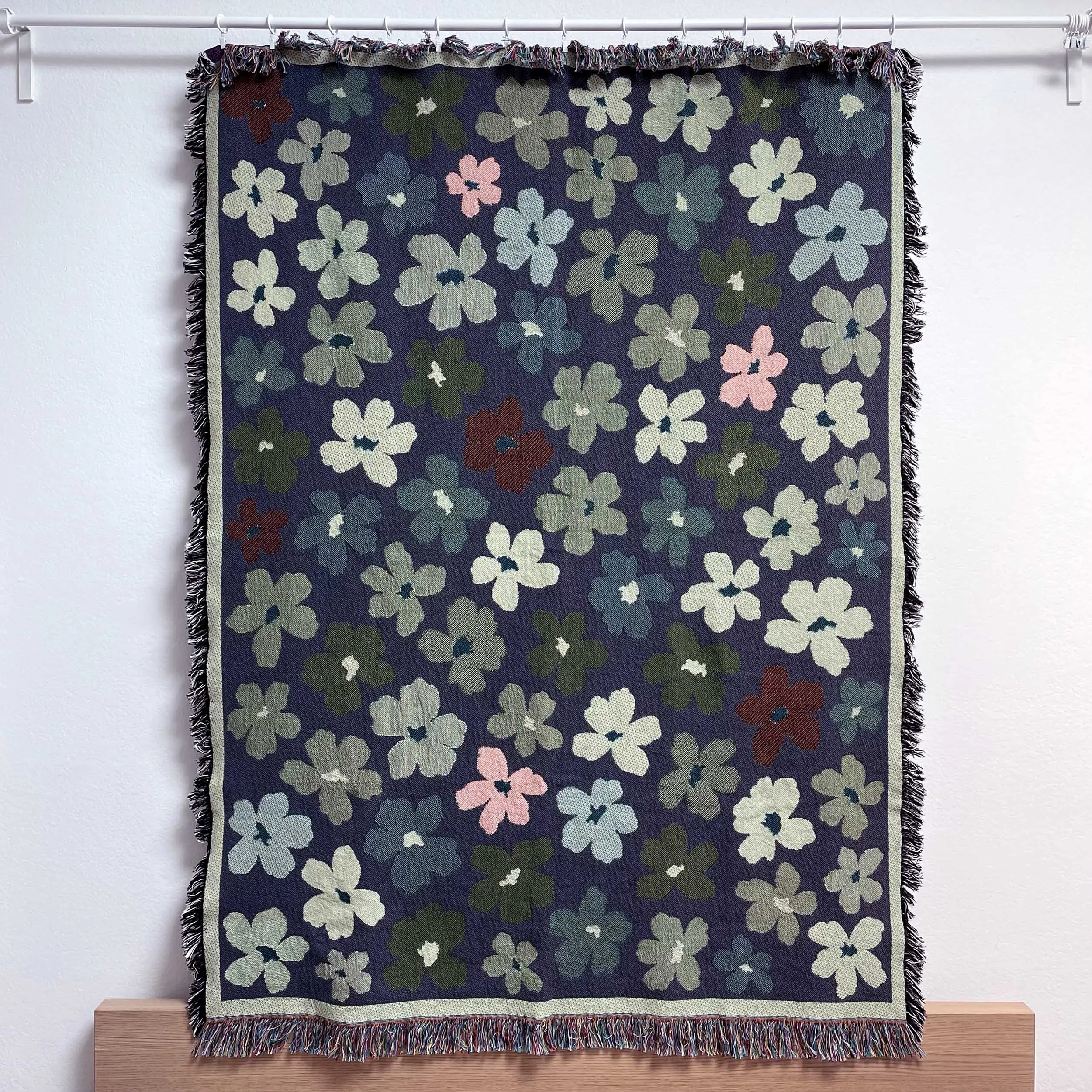 Woven cotton throw blanket by Regina Kareev shown from the back