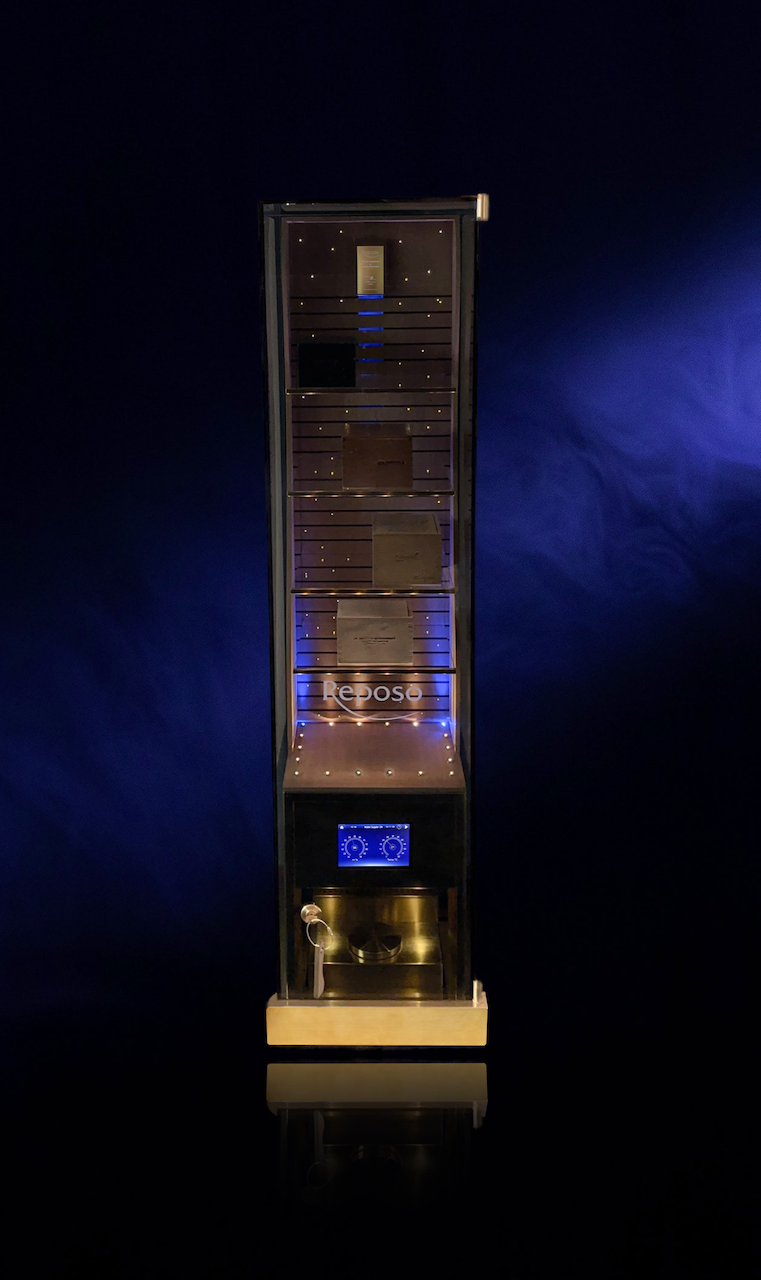 A tall, black unit with a wooden base, featuring multiple shelves with lighting and a display screen at the bottom, labeled "Reboso."