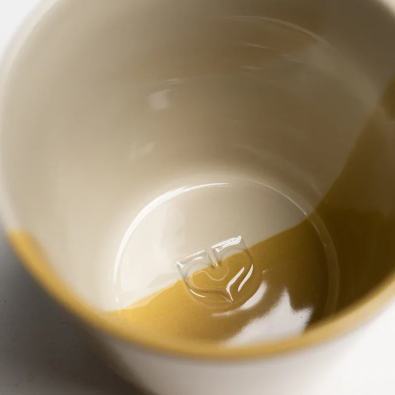close_up_mustard_yellow_rue_beaker.webp