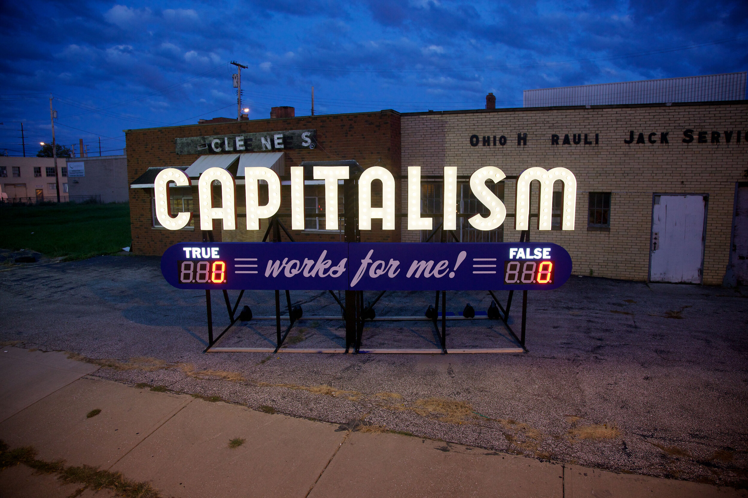  Capitalism Works For Me! True/False, 9 ft x 20 ft x 7 ft, Aluminum and electrical, 2011 