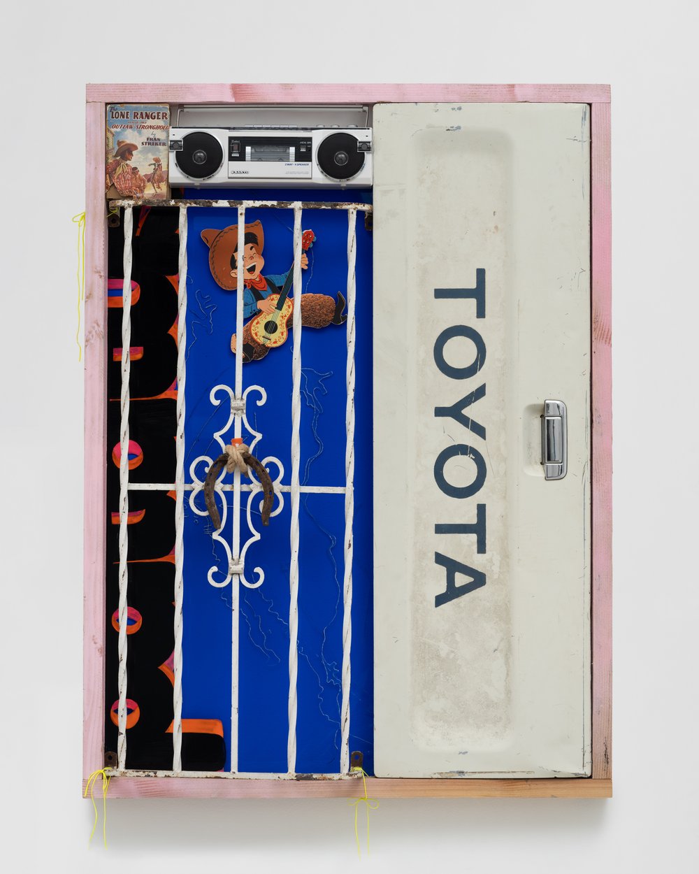   Lorena Ochoa    EVAPORATIONS   Toyota truck tailgate, Lone Ranger book, American Pride cassette, wooden cowboy, sick boombox, acrylic, wood, and intaglio on plexiglass  58 x 43 x 3 inches  2024  