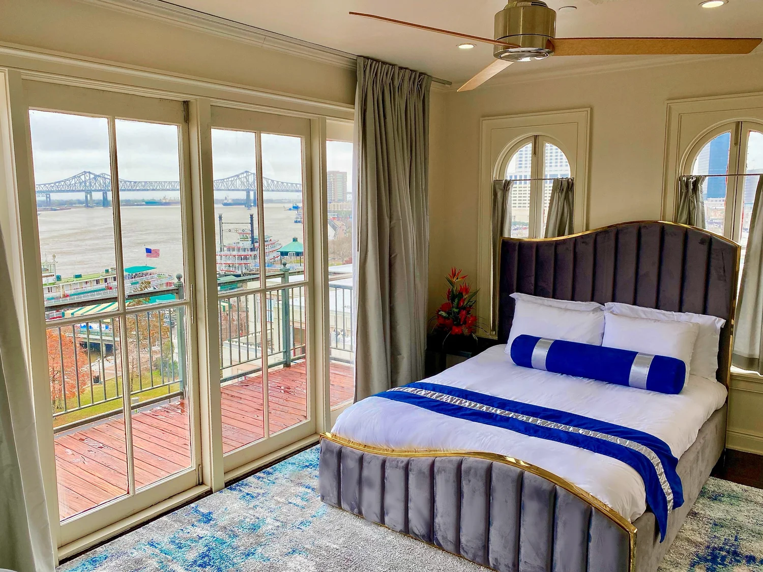 Bedroom with balcony doors overlooking the Mississippi River at Jax Brewery in New Orleans