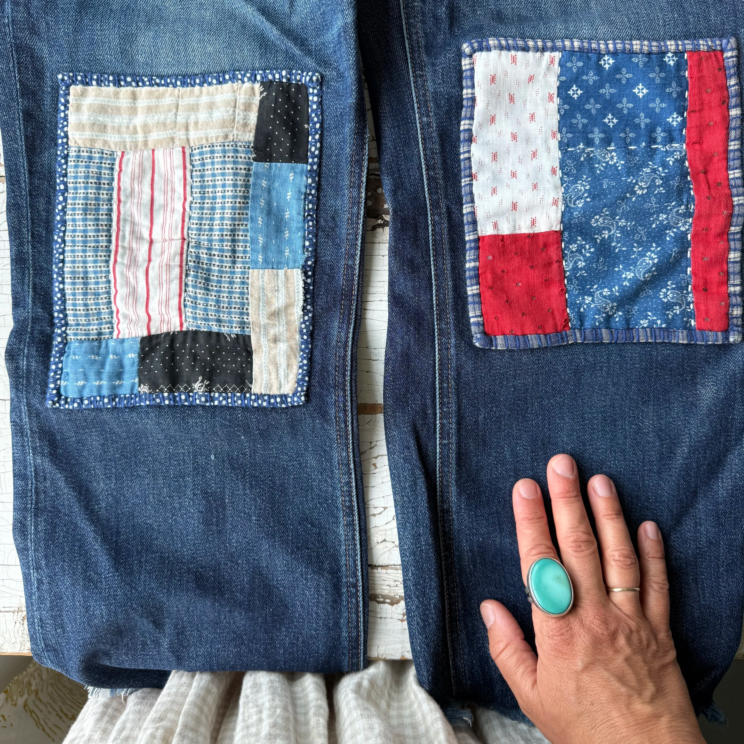 Jeans patched with quilt squares.