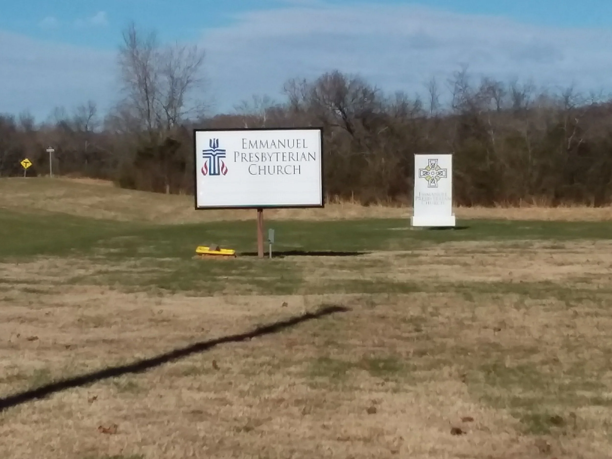 Emmanuel Presbyterian Church signs on grassy field