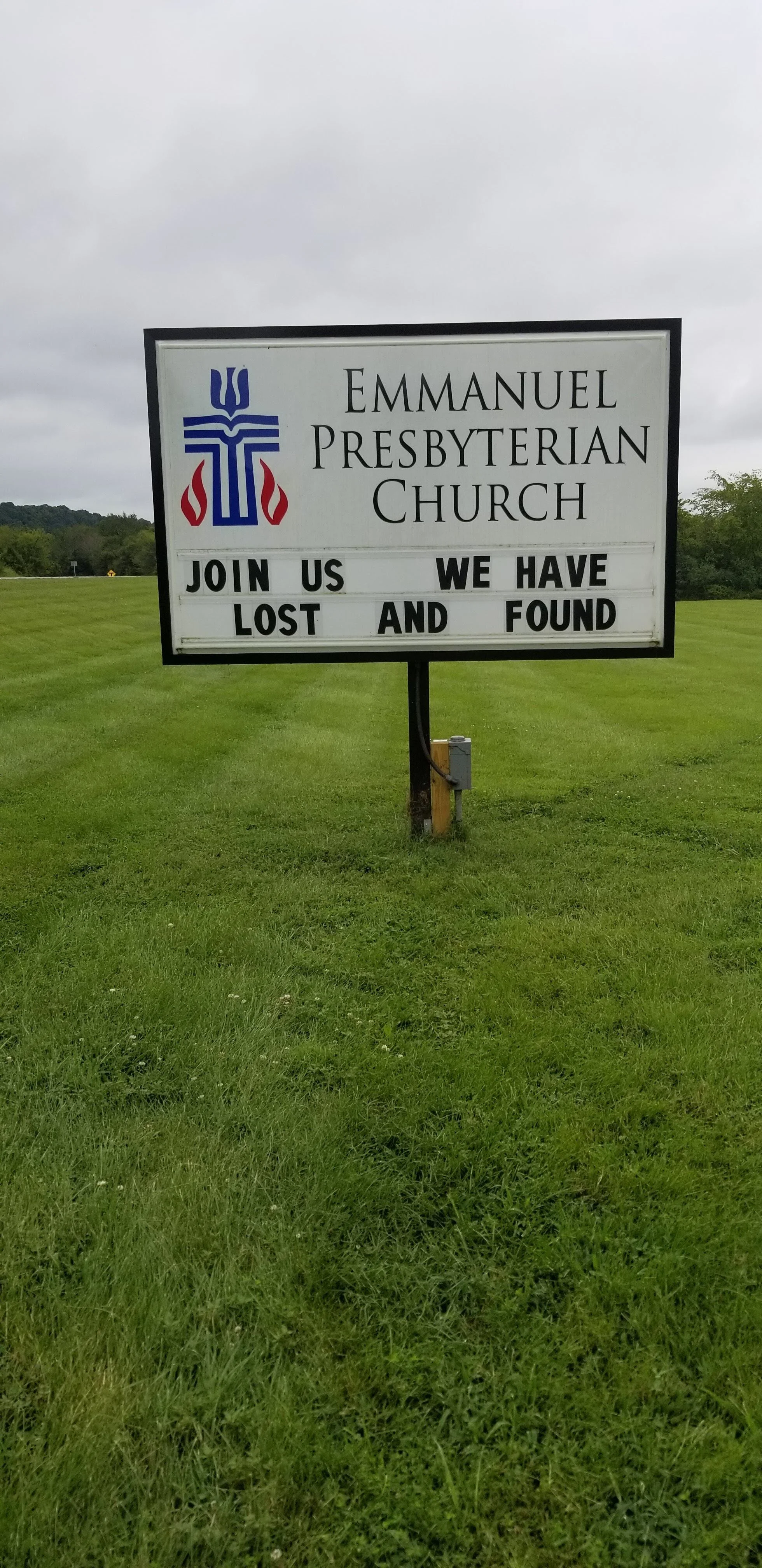 Sign for Emmanuel Presbyterian Church on a grassy field with the text "Join us, we have lost and found."
