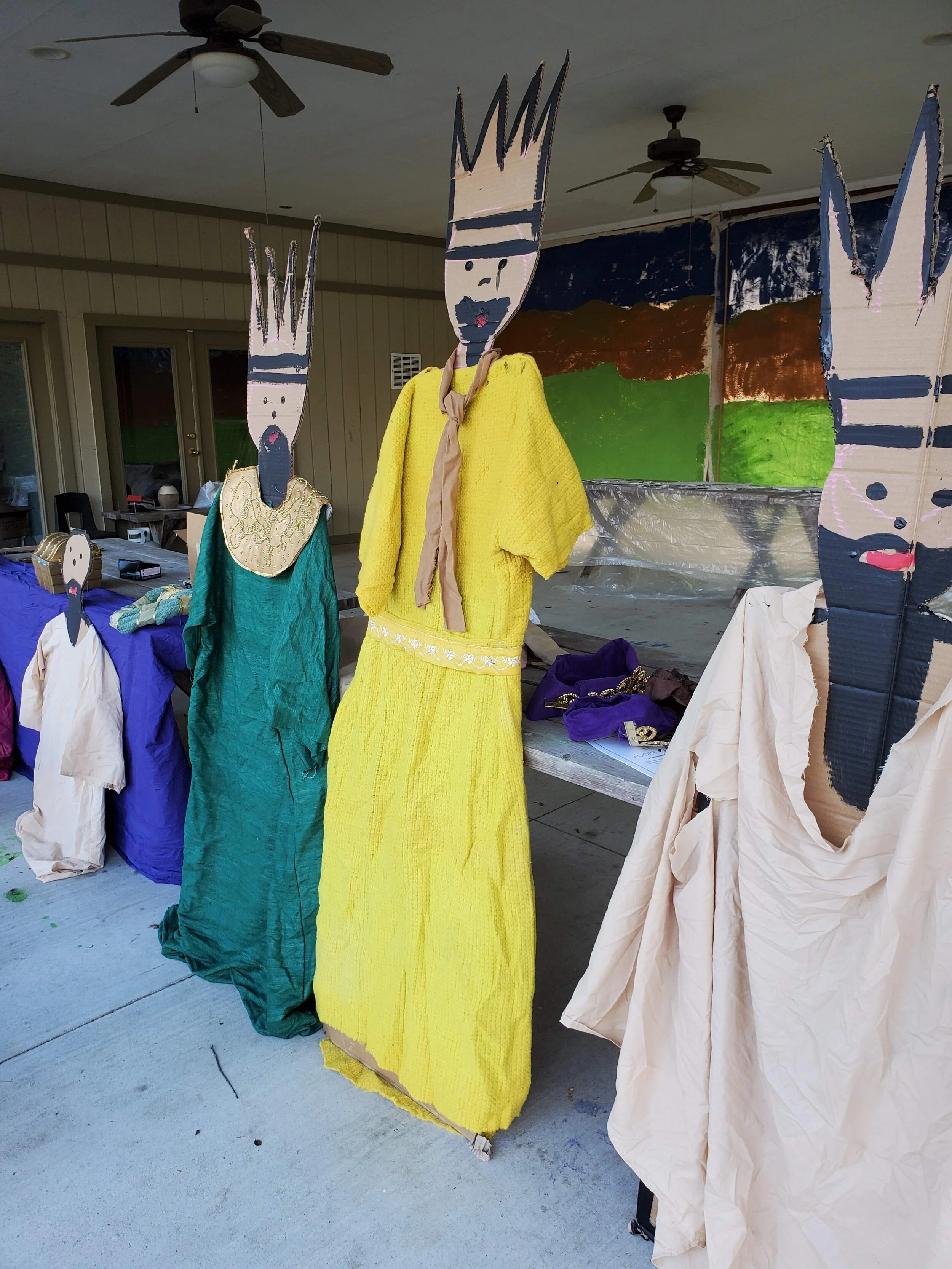 Cardboard cutouts dressed as kings with crowns