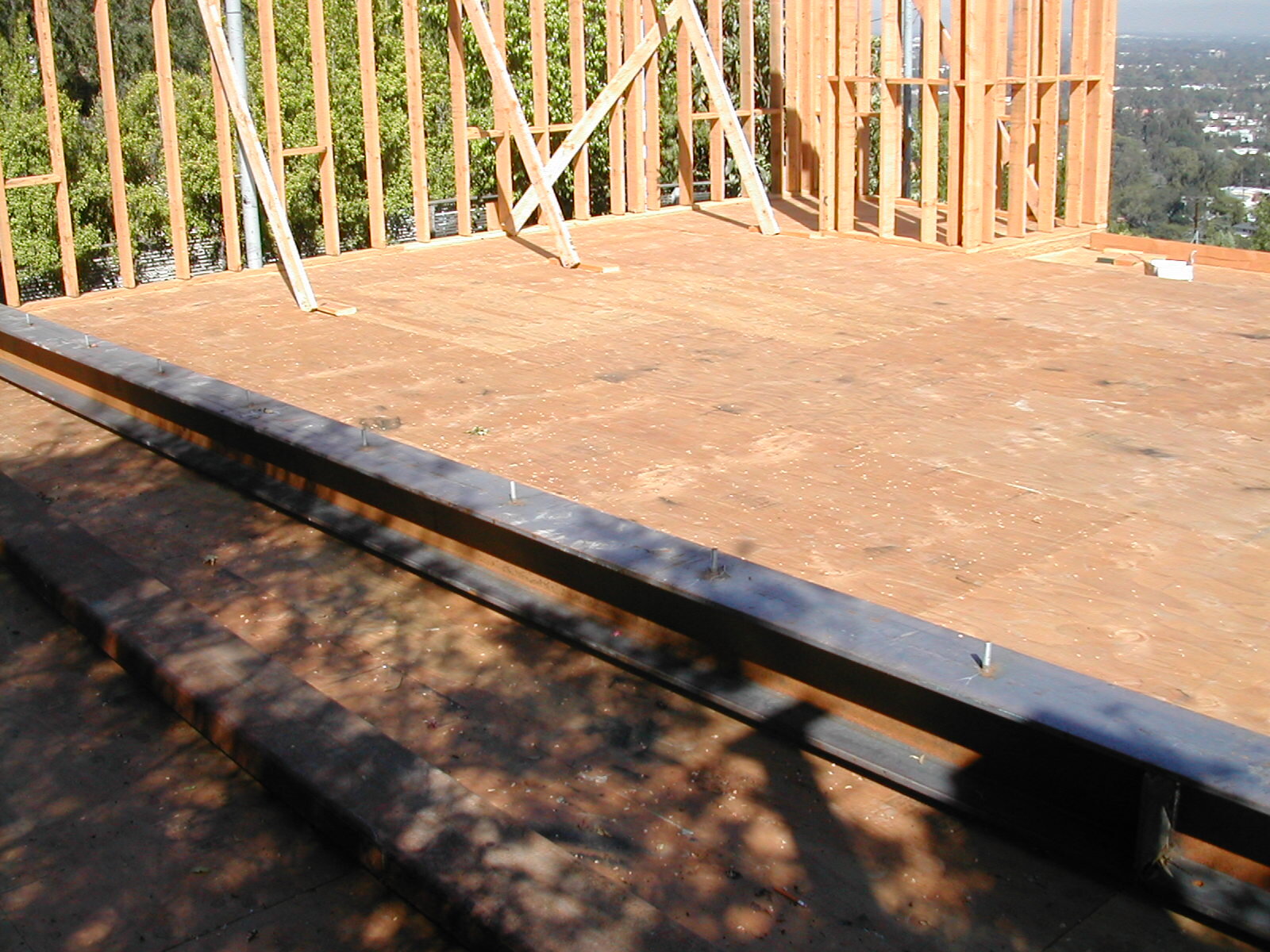  A steel beam sitting on the second story floor, awaiting installation. Generally, I am not inclined to run a job sequentially by completing one phase and then moving to the next. Although some subcontractors disagree with this view, I find it more p