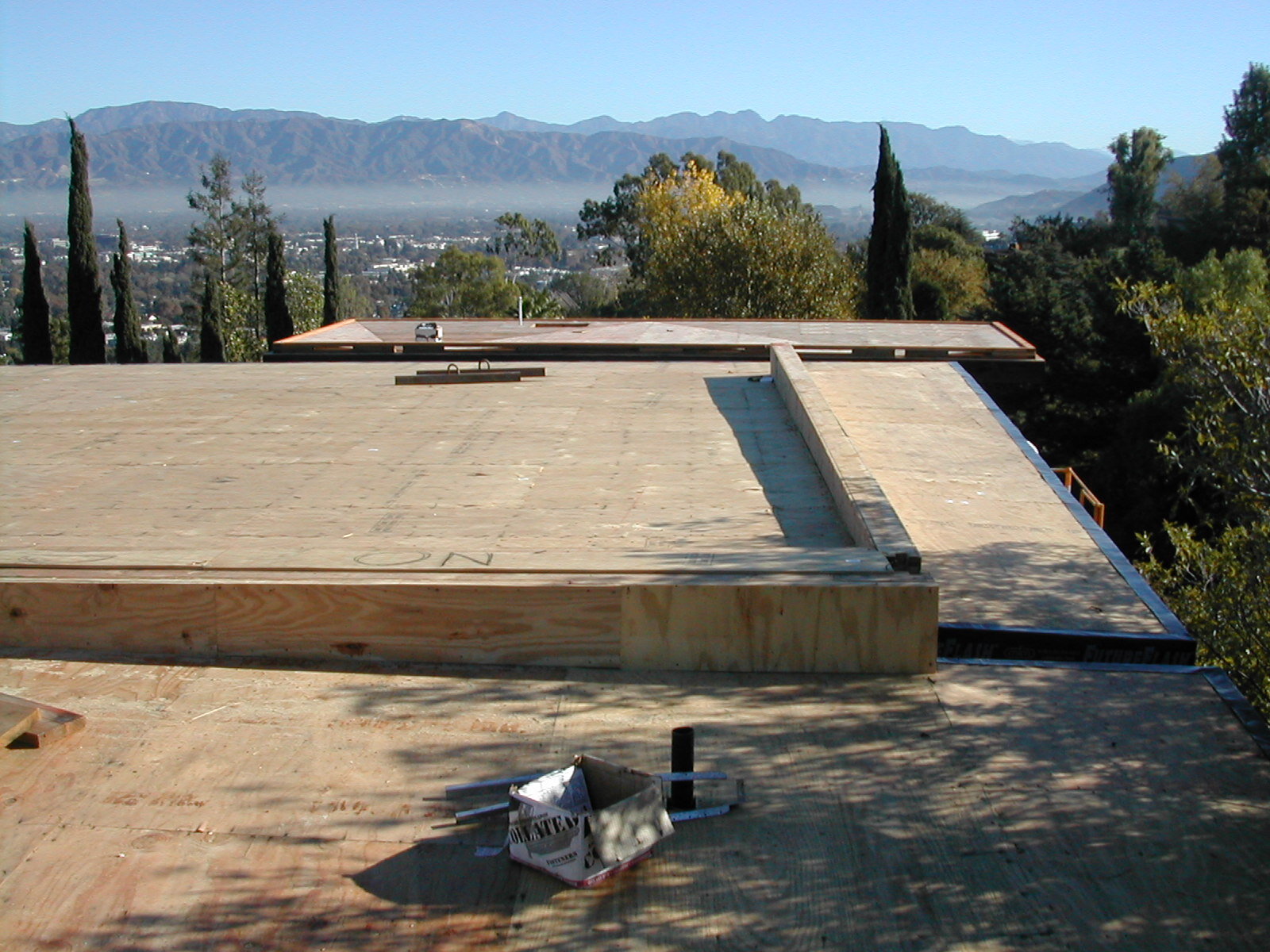  Not a bad place to go to work. The roof diaphragm plywood installation is complete and waiting for a city inspector prior to roofing. A box of shear nails is left behind as confirmation for the inspector that we have used nails that are the proper l