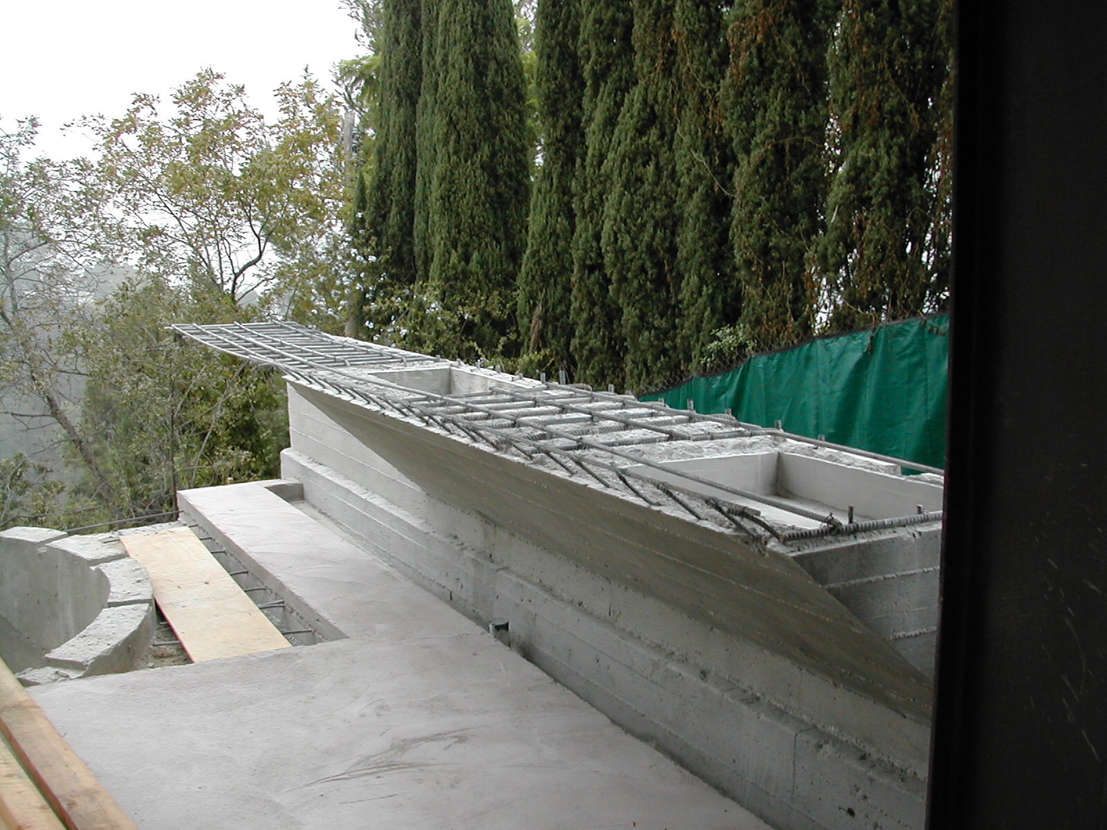  10.02.03 There were no structural drawings for this cantilevered shelf, which will eventually hold a sink and a barbecue. After pouring nearly seven hundred cubic yards of concrete for the foundations and walls, our subcontractor didn’t even need to