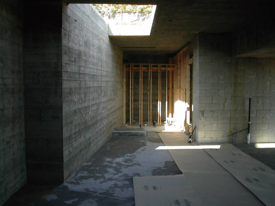  05.22.03 As the basement concrete formwork is removed, once again, Scarpa’s intentions are revealed and new opportunities arise. The opening in the basement ceiling for the stair is also considered a light well and will influence the design of the s