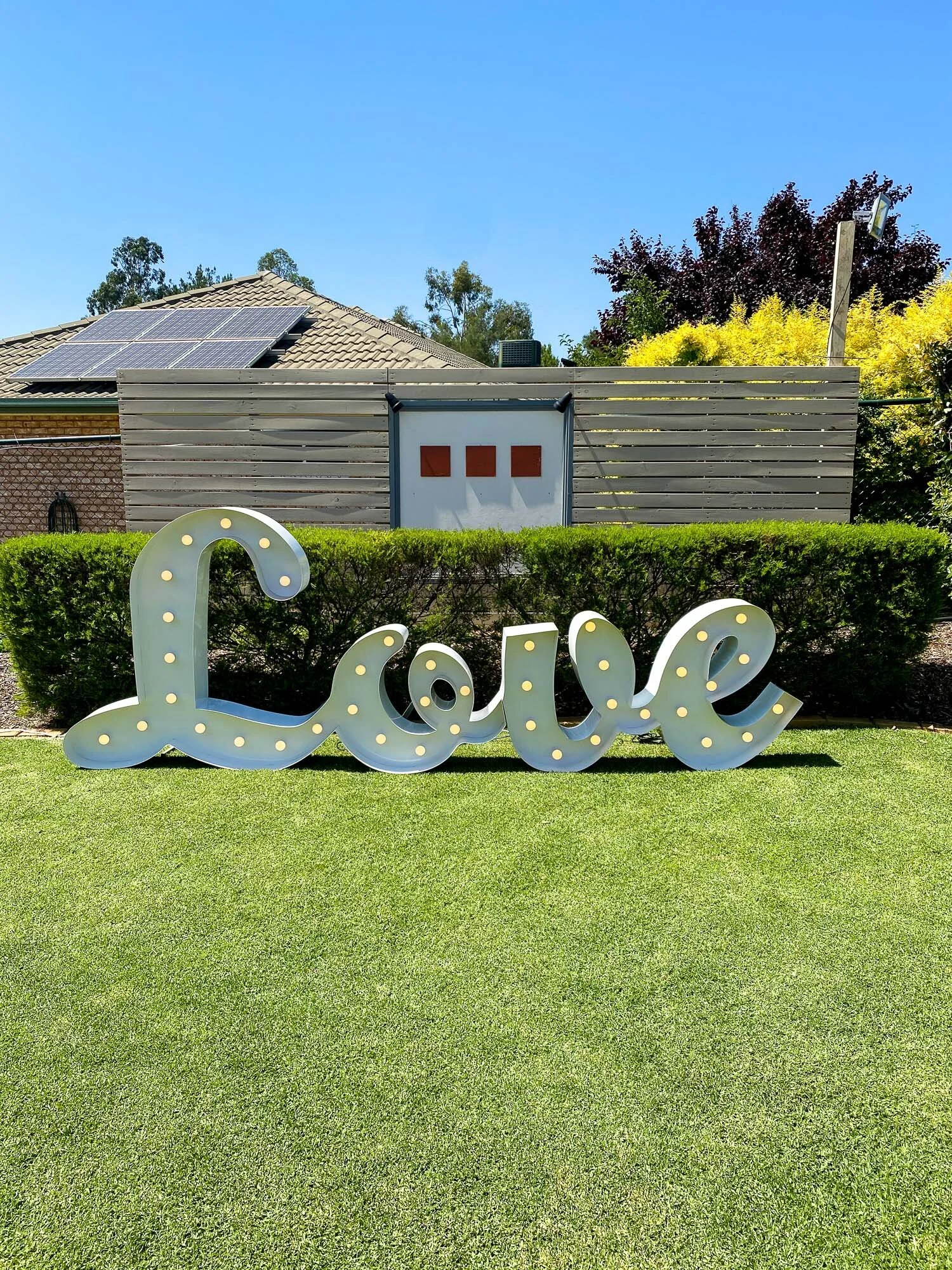 Large lght up cursive LOVE sign.jpg