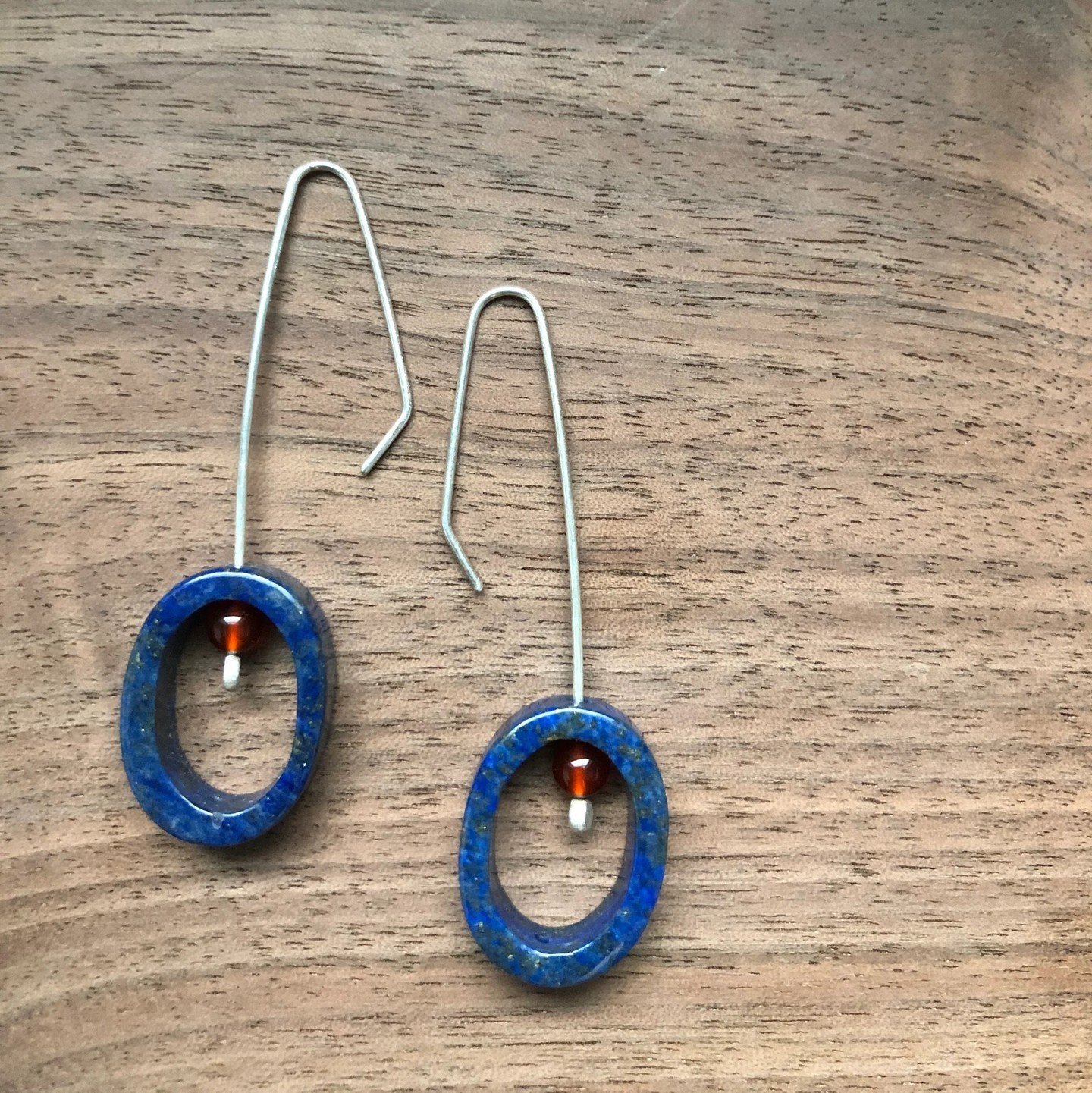 We are happy that Kit Burke-Smith will be back with us at the Stone Avenue Stop for the spring Craft Crawl! She uses traditional hand-fabricated metalsmithing methods to create jewelry designs that reflect nature and are both minimalist and sculptura