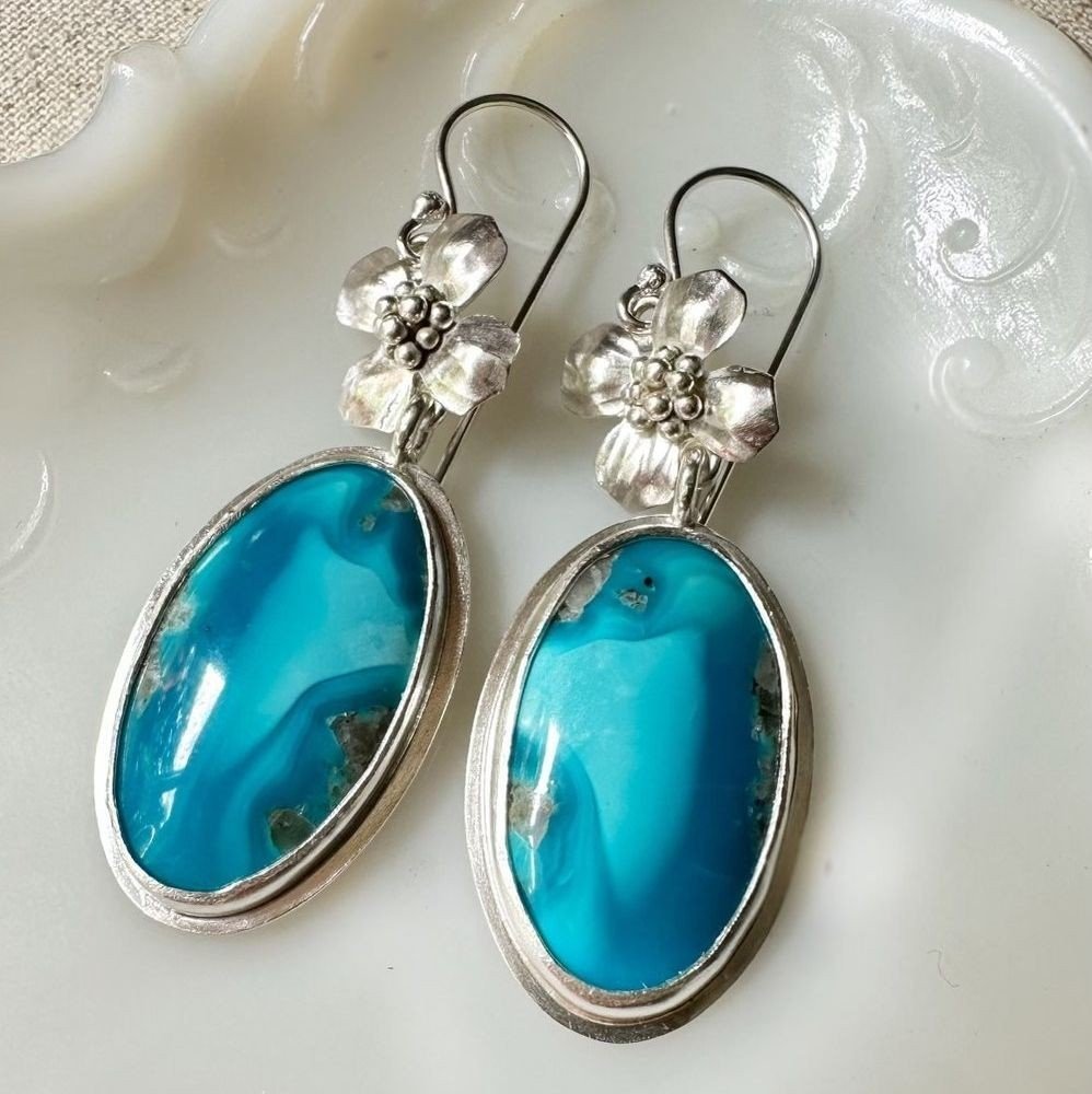 Formally trained as a sculptor, Christine Peters designs and creates each piece of her jewelry by hand in her studio in Maine. Her designs are inspired by the natural beauty she sees on her daily walks and executed in sterling silver, 18 karat gold a