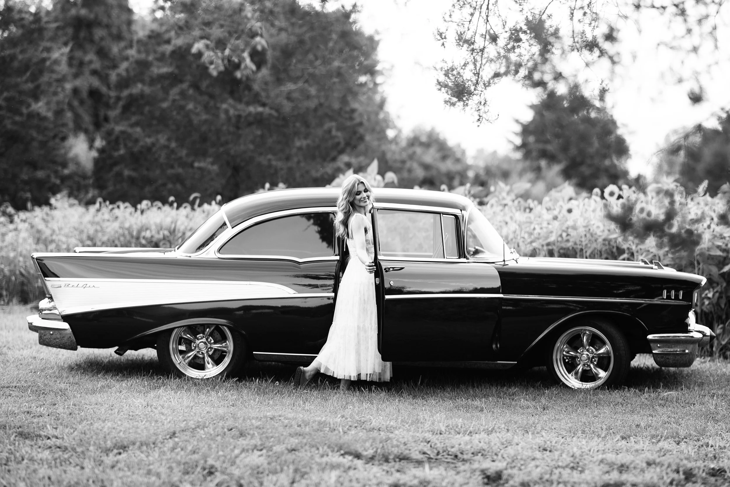 Beautiful black and white photo of Senior girl in sunflower field Marion Illinois with vintage car