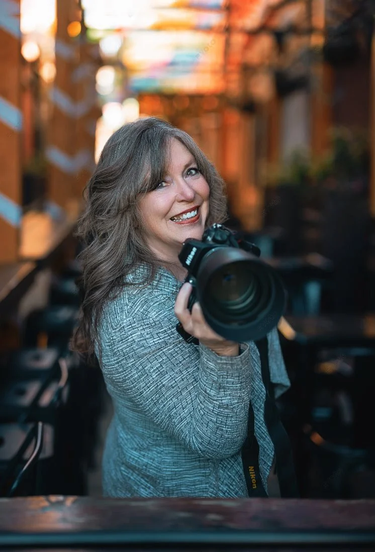 Photographer Sharon Wallace with camera Redlands California Umbrella Alley