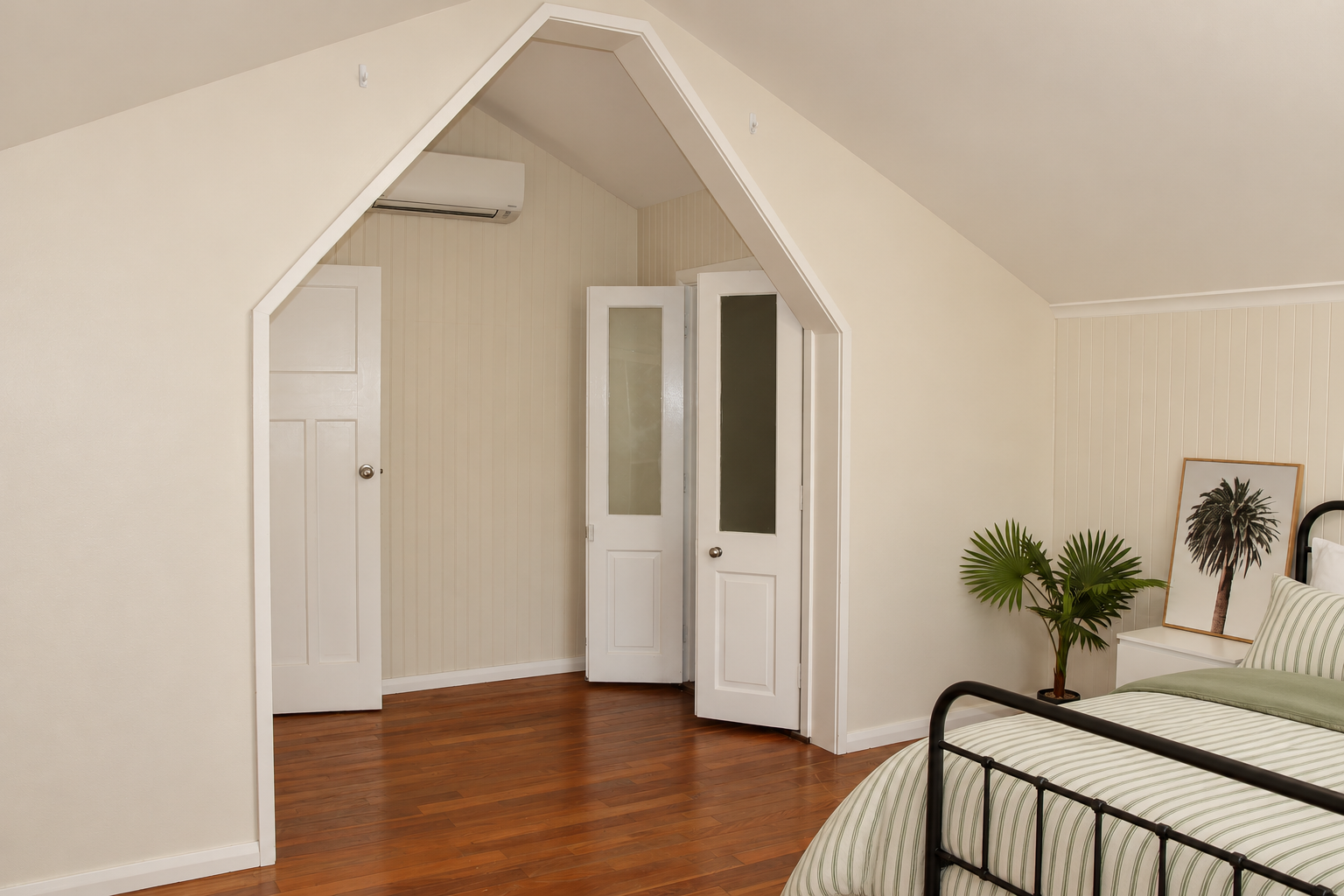 Pointed-Arch Bedroom with Sage Striped Bedding.png