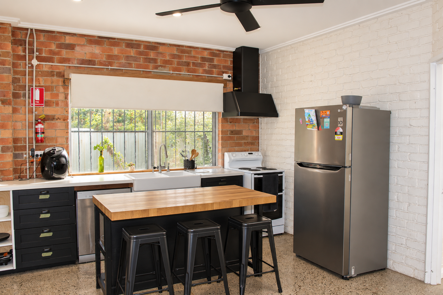 Warm kitchen with stools by island.png