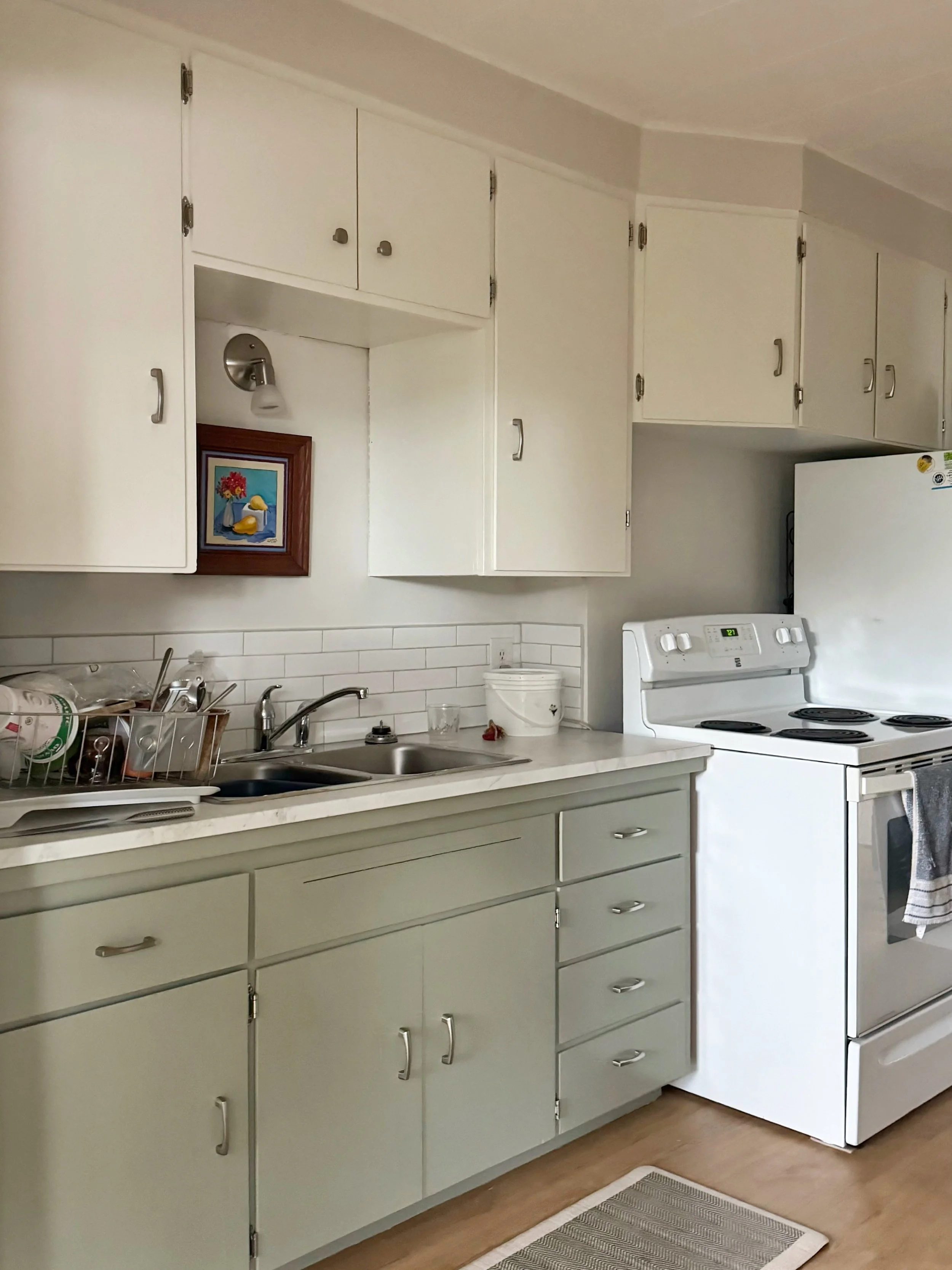 Here are some before and after photos of the cabinet refinishing job I&rsquo;ve just finished up. A great example of how a thoughtful coat of paint can totally transform a space. 

This dated 1980&rsquo;s kitchen is now feeling brand new and fresh, f