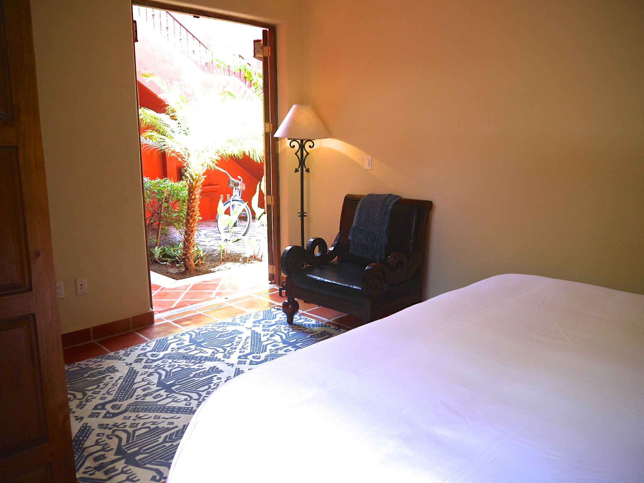 Ground floor master bedroom opening onto main fountain courtyard that the villa is built around