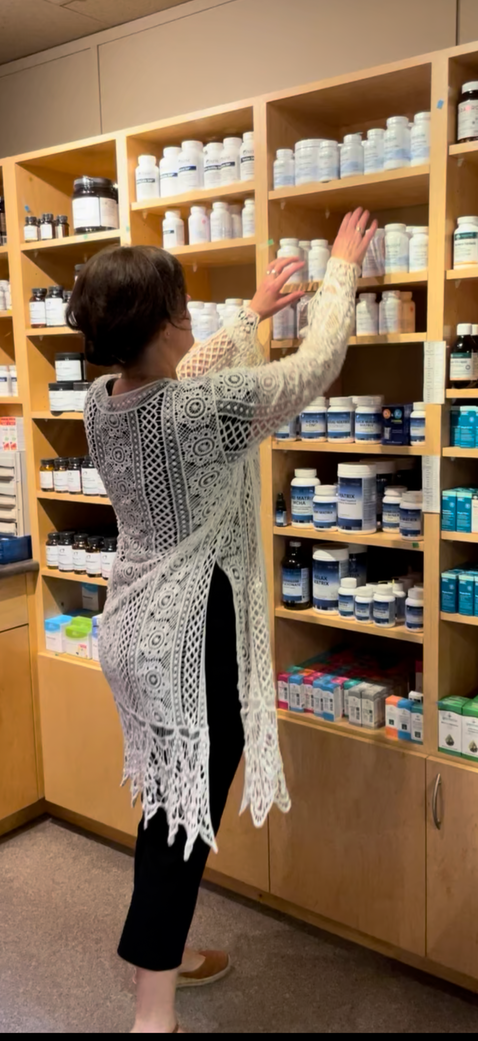 Dr. Lisa Polinsky, ND, reviewing supplements in her office at Circle Integrative Wellness