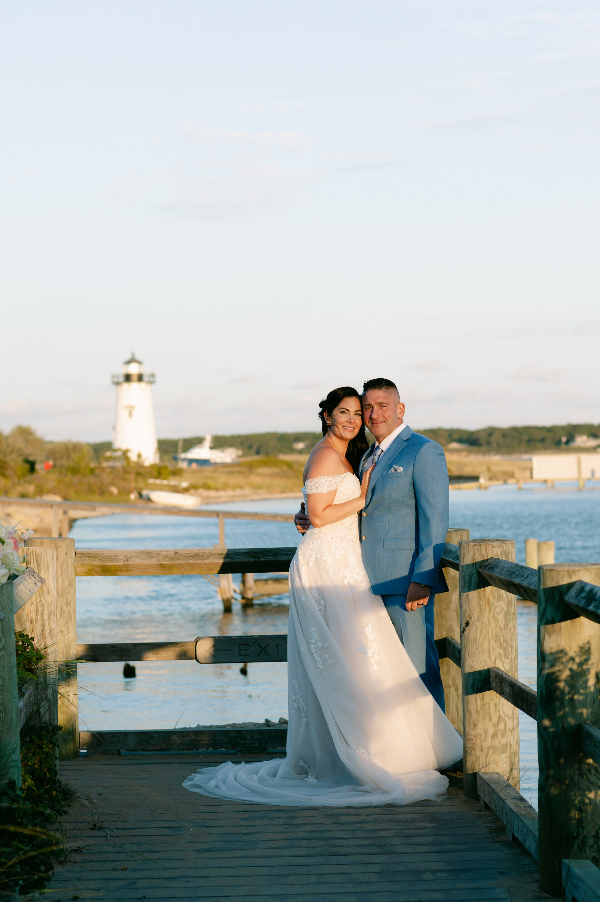 Married couple with lighthouse in background.jpg