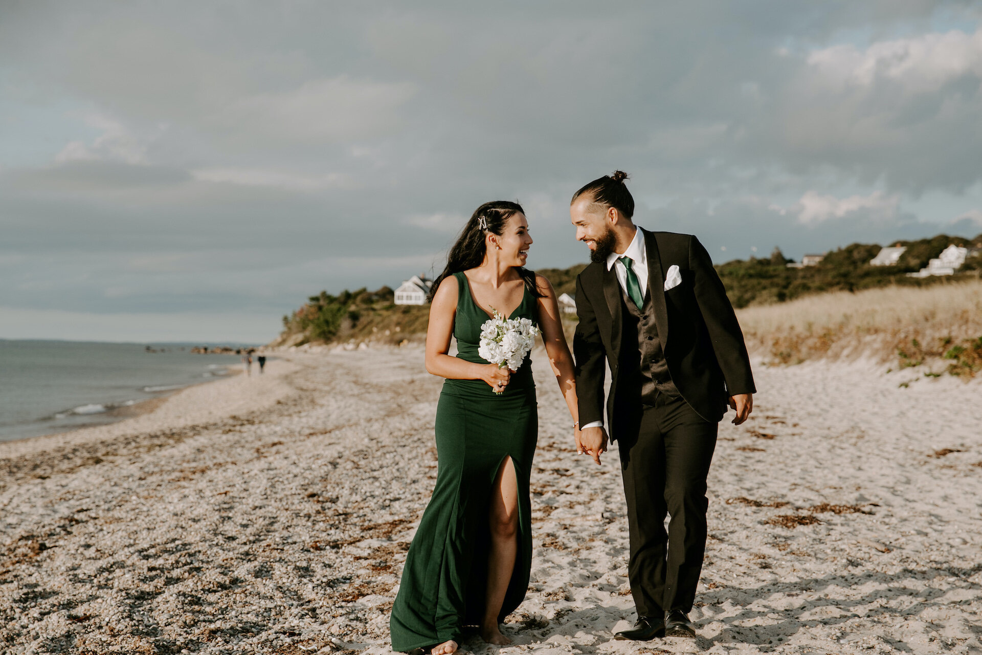 Couple holding hands on beach.jpg