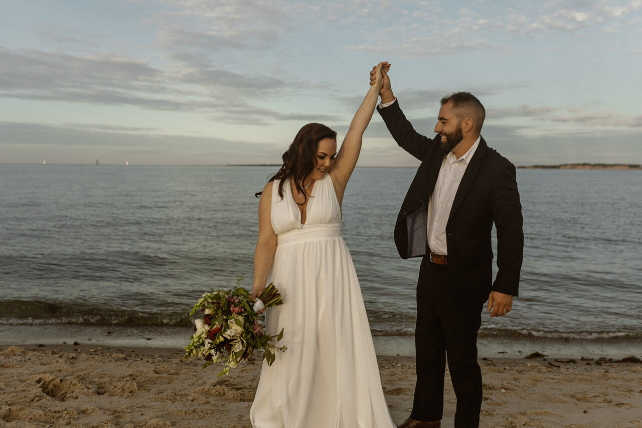 A groom spinning his bride in their first dance