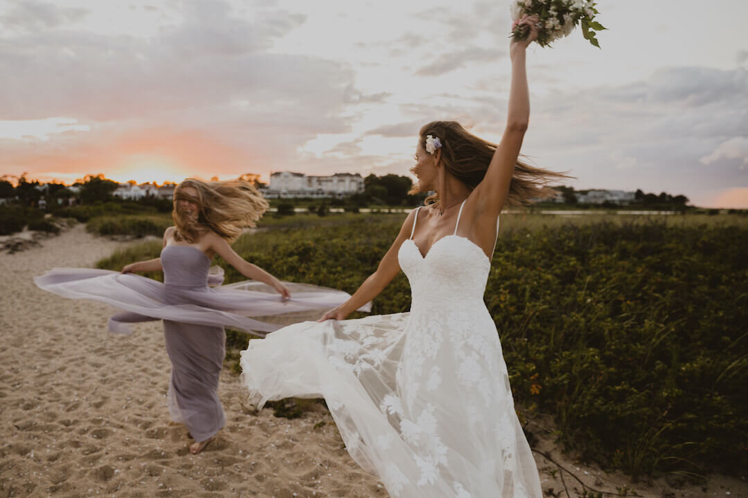 Bride and maid of honor dancing during a sunset on marthas vineyard.jpg
