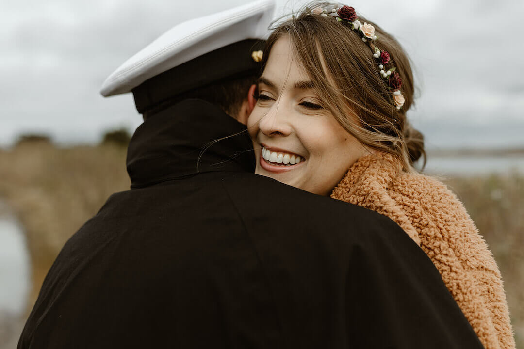 Couple cozying up after wedding with romantic beach photography on marthas Vineyard.jpg