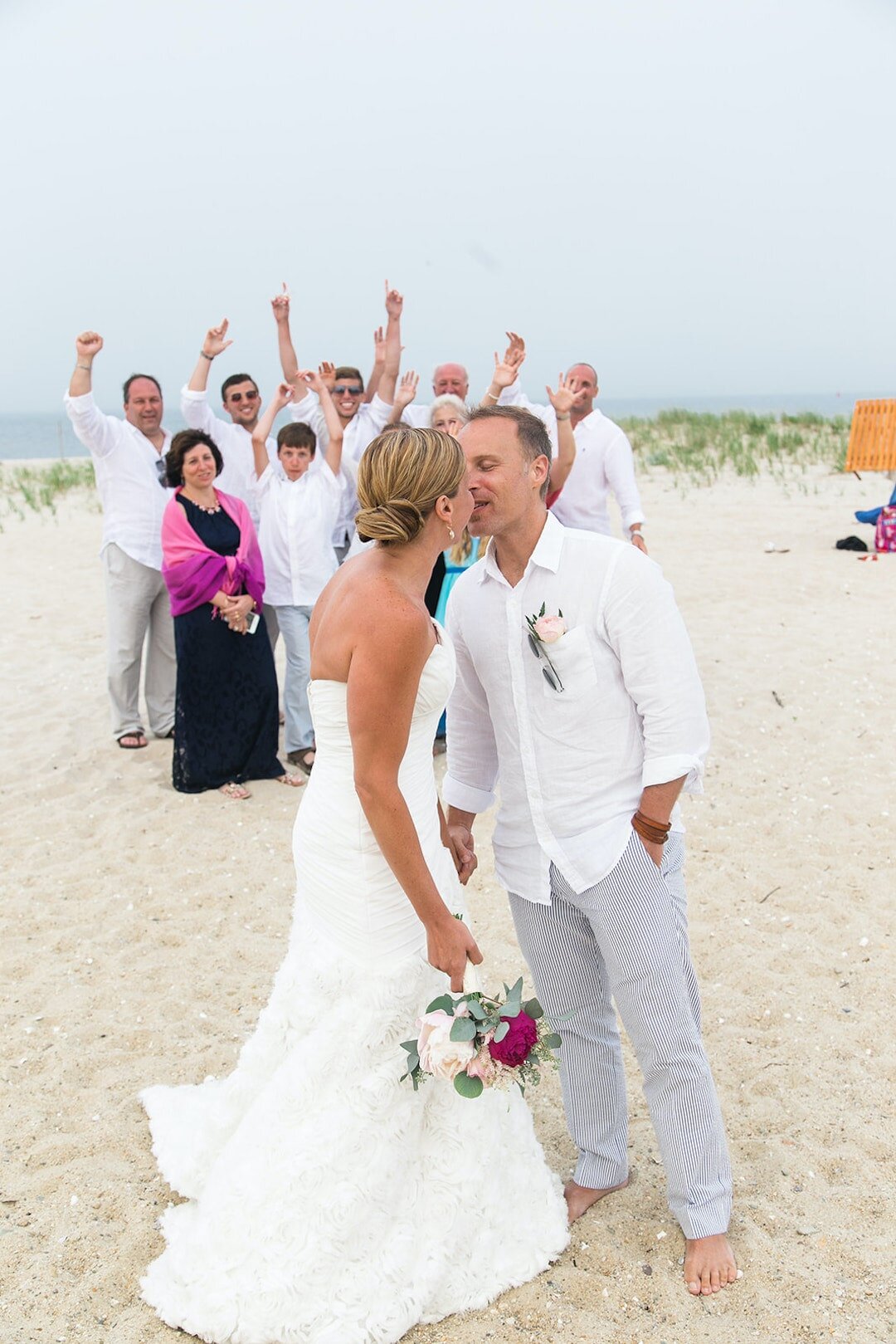 Couple elopement on Marthhas Vineyard with family in background.jpg
