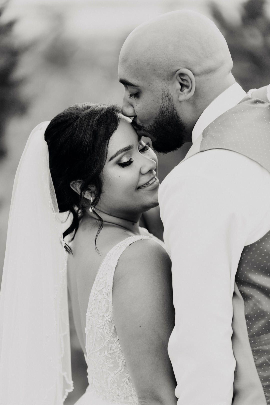 couple kissing and looking off in the distance.jpg