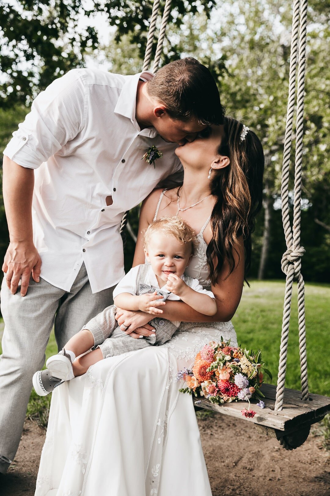 family portrait after MV elopement ceremony. Holding a baby on a swing.jpg