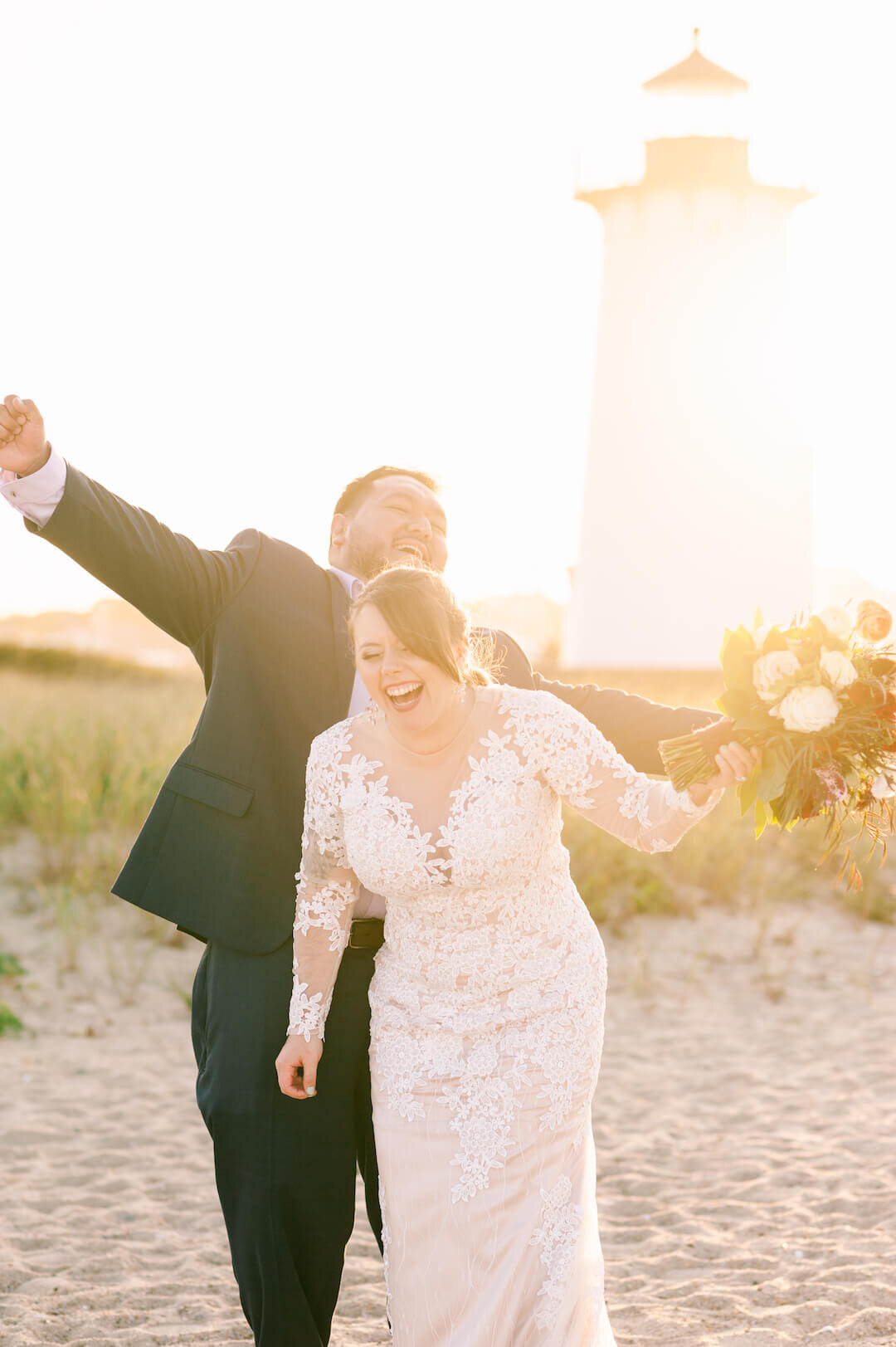 Happy couple with edgartown lighthouse in background on Marthas Vineyard.jpg