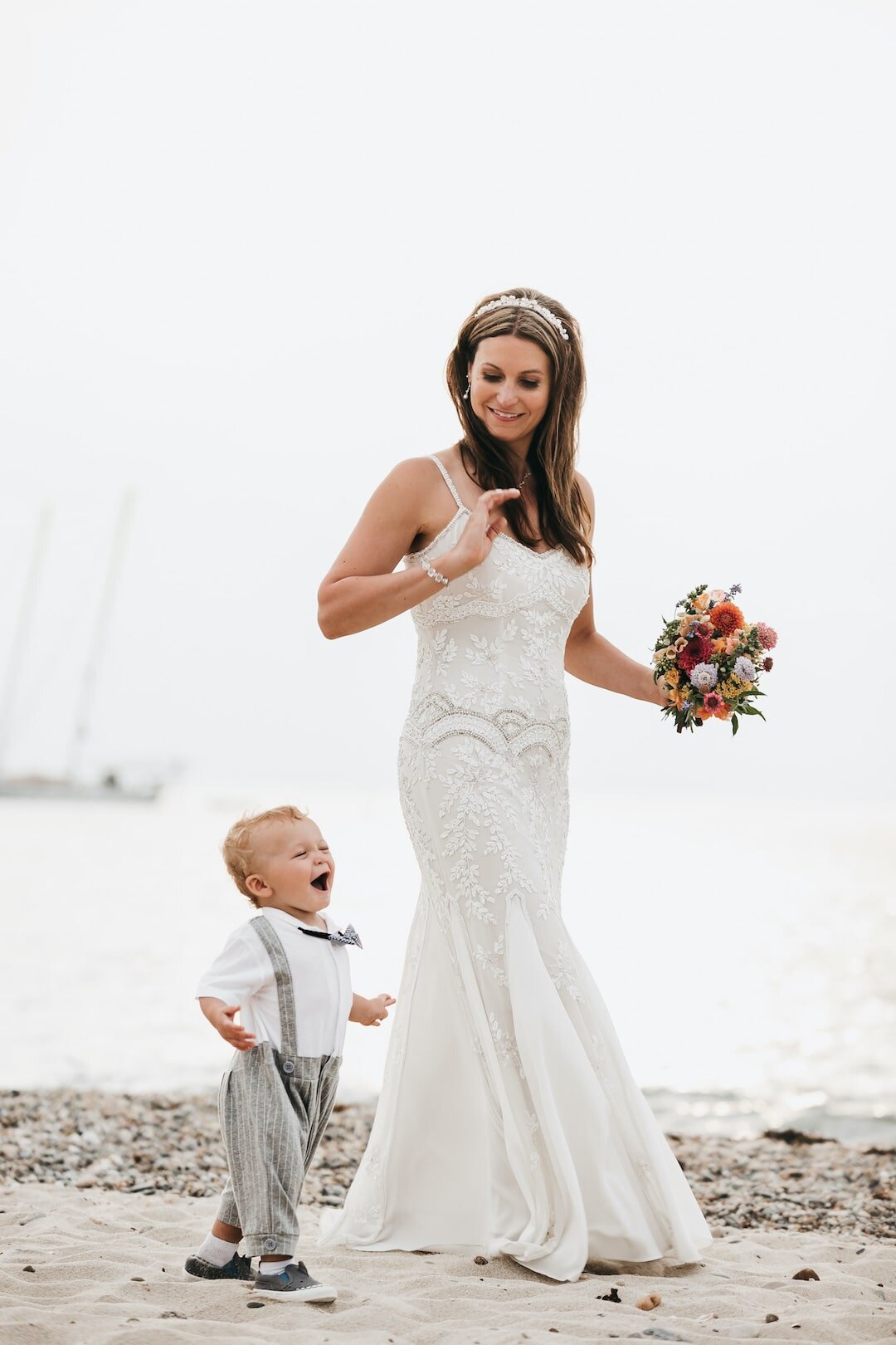 Mom and child on marthas vineyard beach after wedding.jpg