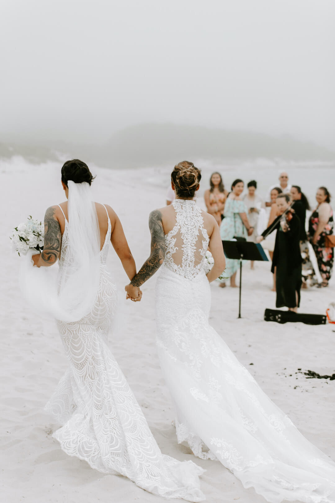 walking down aisle on the beach wedding on marthas vineyard.jpg