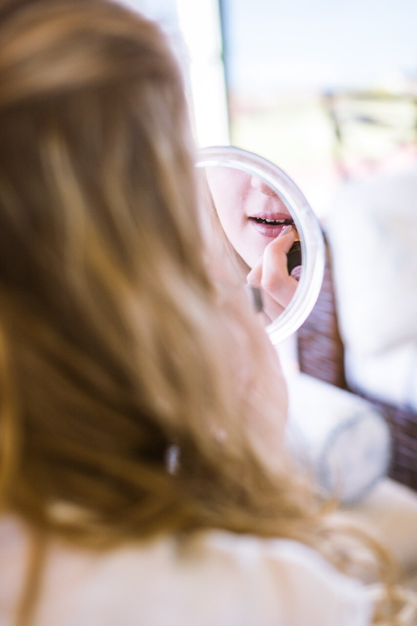 Bride fixing makeup