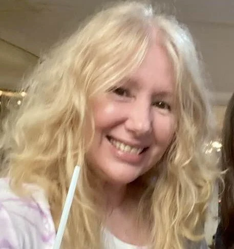 Raina head shot 3.jpg