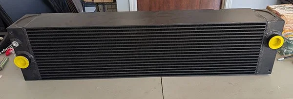D6K Power train oil cooler