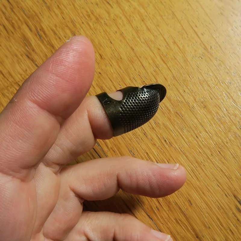 Fingerbøl justerbart