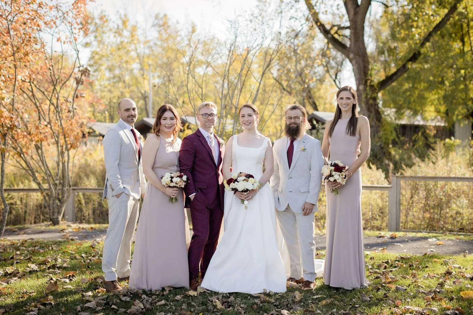Wedding couple with friends outdoors at Hutton Brickyards
