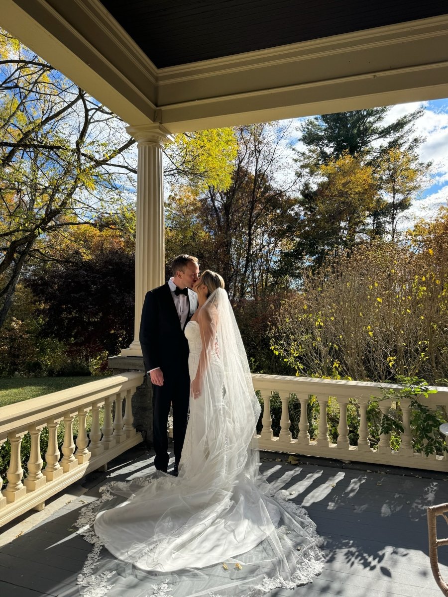 Kissing on balcony-Jillian-Wedding.jpg